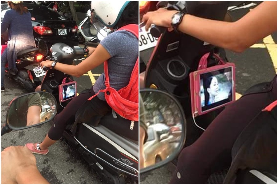 ▲一名婦女邊騎機車、邊看iPad。（圖／翻攝自爆料公社）