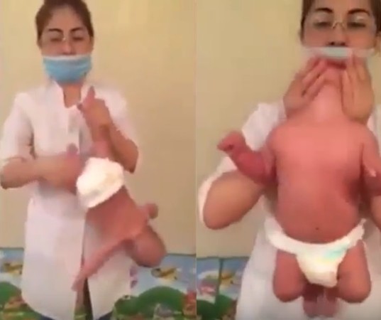 ▲▼ 哈薩克35歲女按摩師拉里薩（Larissa Orynbasarovna）幫寶寶按摩，把嬰兒懸空倒栽蔥左右晃。（圖／翻攝自Youtube）