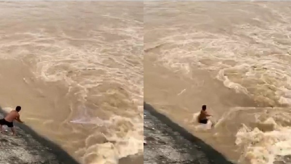 洪水暴漲冒出好多魚！半裸男涉險在岸邊灑網　鏡頭前6秒被吞沒。（圖／翻攝自微博）