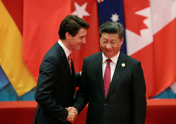 ▲加拿大總理杜魯道與習近平握手 。（圖／路透）