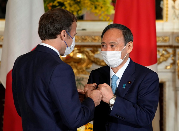 ▲▼法國總統馬克宏（Emmanuel Macron）和日本首相菅義偉在東京奧運期間見面。（圖／路透）