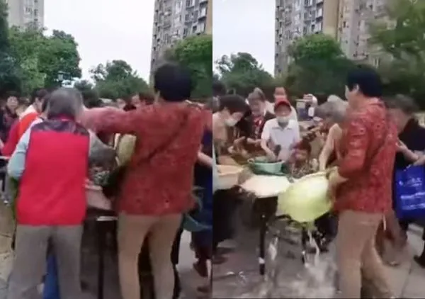 ▲▼誰都沒有!搶不到免費的粽葉生米 大媽怒出手掀翻灑一地。(圖/翻攝自微博)