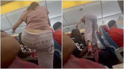 搭長途飛機要回靠窗座位！　他拍下「襪子女爬扶手跨頭」穿越乘客
