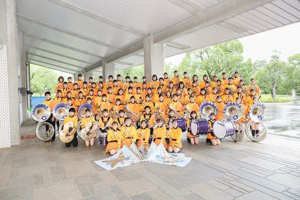 ▲▼有「橘色惡魔」稱號的日本京都橘高校吹奏部，應中華文化總會之邀，於2022年國慶大會演出。（圖／翻攝中華文化總會臉書）