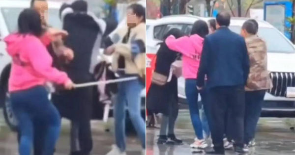 大街上驚見女子拿長棍打老公。（圖／翻攝自微博）