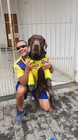 巴西愛狗狗的郵差。（圖／翻攝自臉書Carteiro Amigo dos Animais）