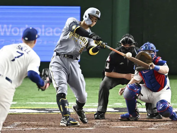 ▲▼阪神虎佐藤輝明面對道奇史奈爾擊出3分砲。(圖/達志影像/美聯社)