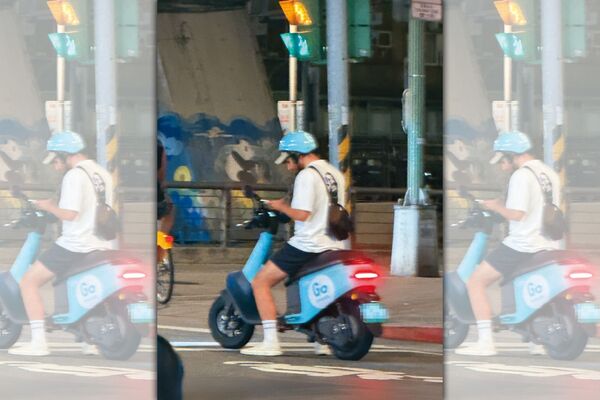 10月12日約晚上8點半,酷Ku騎著共享電動機車現身台北市長春路與新生北路口一帶。(讀者提供)