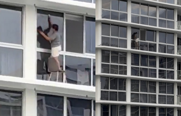 大膽女無裝備爬出16高樓「踩在椅子上擦窗」 玩命畫面瘋傳。(圖/翻攝自X)