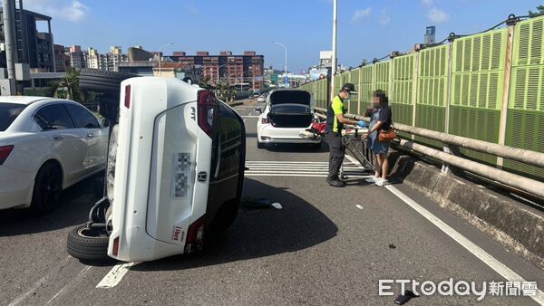 ▲國1北上大業隧道出口轎車側覆 女駕駛輕傷脫困。(圖/記者郭世賢翻攝)