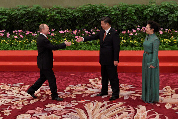 普丁（Vladimir Putin）和習近平會面。（圖／路透社）