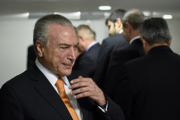 巴西總統泰梅爾（Michel Temer）被爆出支付封口費給涉嫌貪汙的前眾議院議長古尼雅（Eduardo Cunha）。（圖／達志影像／美聯社）