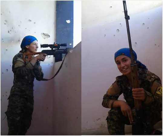 ▲▼一名隸屬婦人民保護部隊（YPJ）女狙擊手發現一顆子彈從頭上掠過時，只是微微一笑。（圖／翻攝自Twitter／Hemze Hamza）