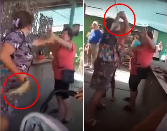 ▲▼烏克蘭一名女顧客在南部格尼奇斯克（Henichesk）港口，用死魚攻擊店員。（圖／翻攝自YouTube／El Diario 24 Horas）