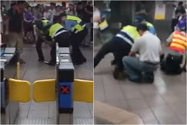 ▲台北車站男子觸動警鈴，遭鐵路警察壓制。（圖／翻攝自爆料公社）