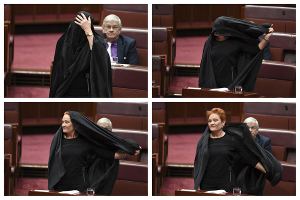 ▲參議員寶琳．韓森穿著全罩式布卡進議會，10幾分鐘後才揭開面紗。（圖／美聯社）