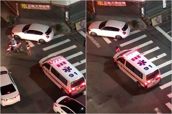 ▲▼吳女站在救護車前擋道，不讓丈夫送醫。（圖／翻攝爆料公社）