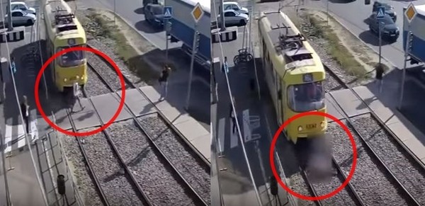 ▲▼ 烏克蘭婦女低頭滑手機，被電車撞斷一條腿。（圖／翻攝自Youtube）