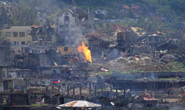 ▲▼菲律賓宣布收復馬拉威市(Marawi)，在最後據點中發現42具親IS武裝份子的屍體。（圖／路透社）