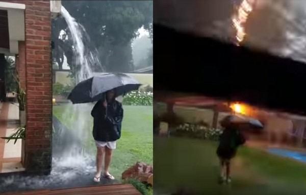 ▲▼ 阿根廷男孩撐傘在雨中玩耍，差點被閃電擊中。（圖／翻攝自Youtube）