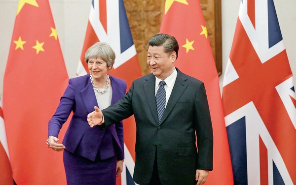 2018年2月初，習近平在北京會見來華正式訪問的英國首相梅伊，透露出中國的國際地位不可同日而語。（圖／新華社攝）