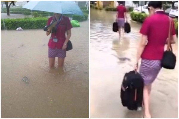 ▲強降雨導致珠海機場大淹水，空服員涉水通行。（圖／翻攝自微博）