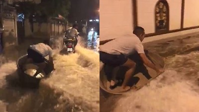 泰國馬路玩衝浪！　3男靠「一台機車+臉盆」趁淹水飆出浪速