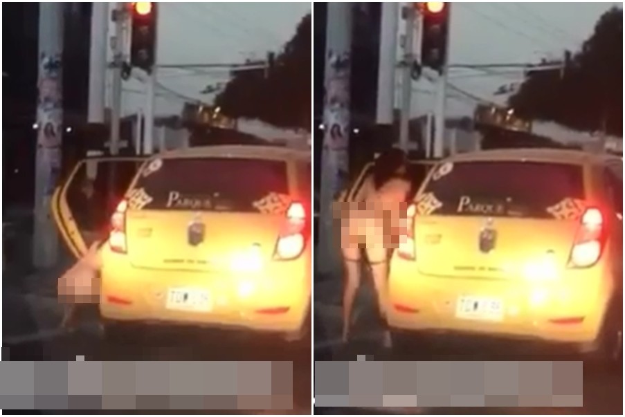 ▲哥倫比亞一名年輕女子搭計程車，等紅燈時竟然下車深蹲尿尿。（圖／翻攝自Liveleak）