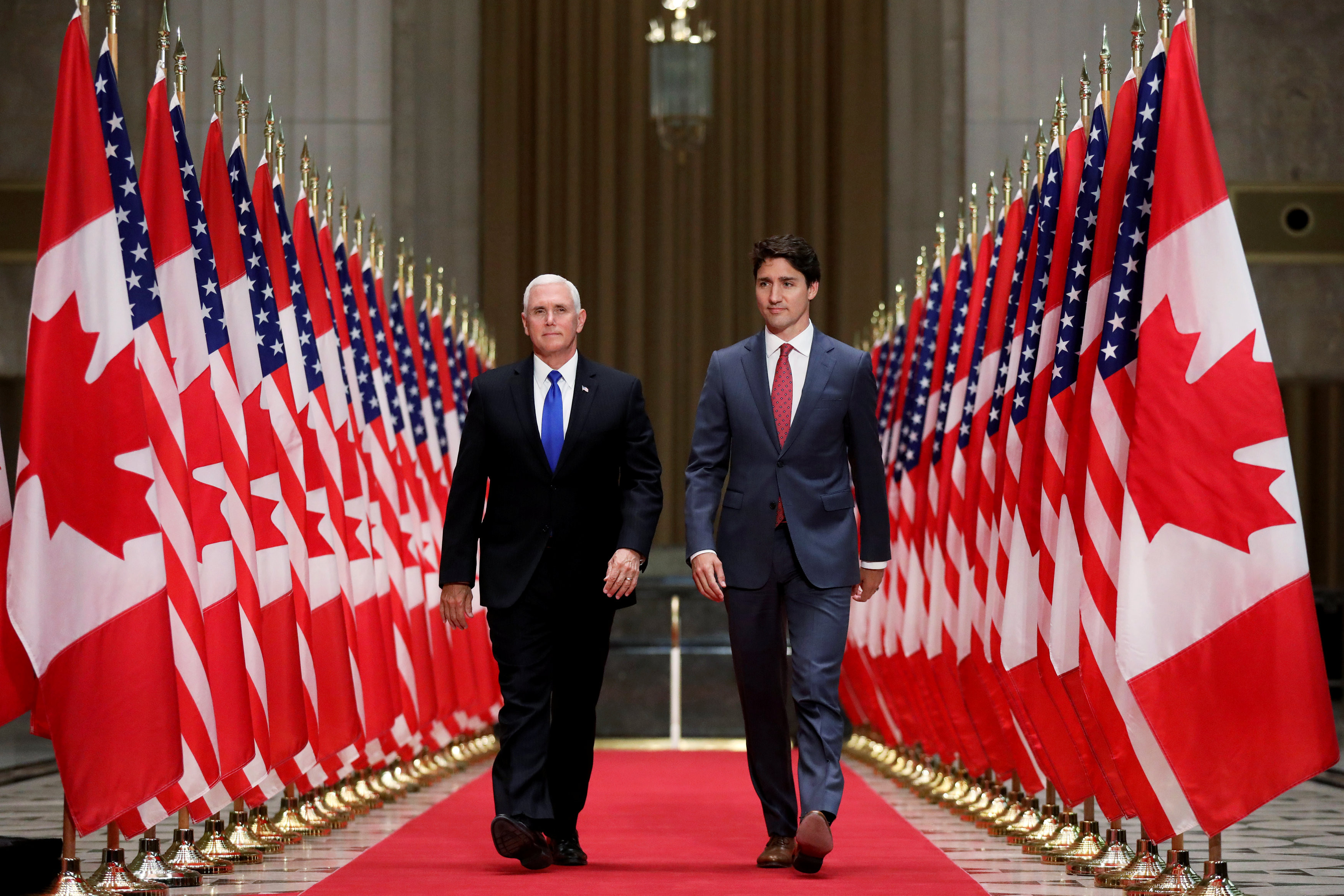 ▲美國副總統彭斯（Mike Pence）與加拿大總理杜魯道（Justin Trudeau）。（圖／路透社）
