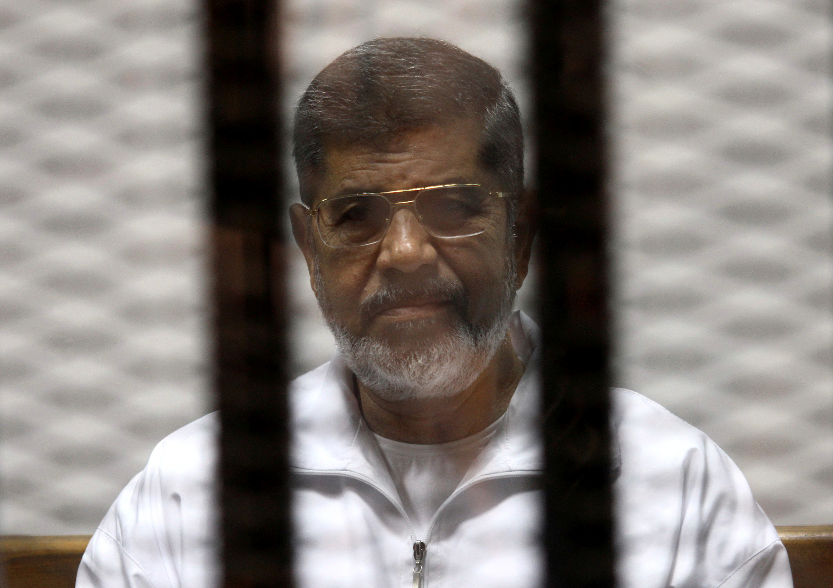 ▲▼埃及前總統穆希遭囚照片。（圖／路透社）