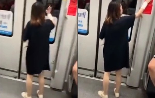 地鐵女手機狂敲車門還亂拉緊急把手　乘客嚇到尖叫阻止她。（圖／翻攝自大陸微博／上海熱門資訊）