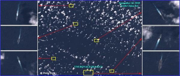 ▲▼美軍雷根號航母在南海疑遭不明軍艦包圍。（圖／翻攝自Twitter／@duandang）