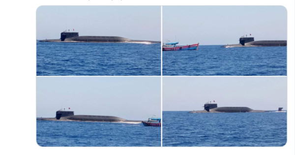 ▲▼解放軍1.1萬噸的09IV晉級核潛艦上浮，同框越南漁船。（圖／翻攝自Duan Dang twitter）