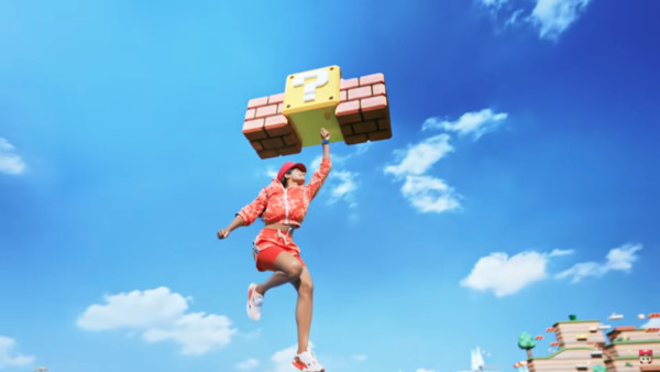新公布的任天堂主題樂園MV中，出現真人敲磚塊的畫面；官方表示這會將在實體的樂園中呈現。（翻攝自Nintendo YouTube頻道）
