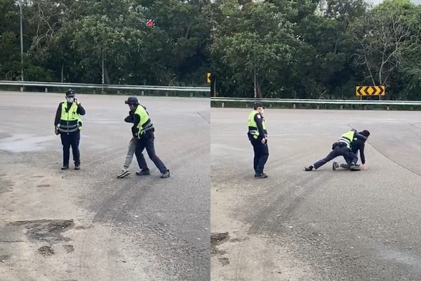 ▲▼員警在路上壓制疑似精神不穩的男子，一旁學長講電話不幫忙。（圖／翻攝網路）