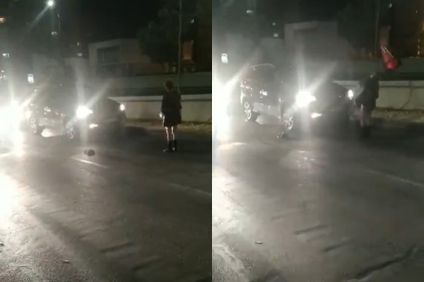 ▲短裙妹大馬路擋車，慘遭三角錐「精準爆頭」。（圖／翻攝「爆廢公社公開版」）