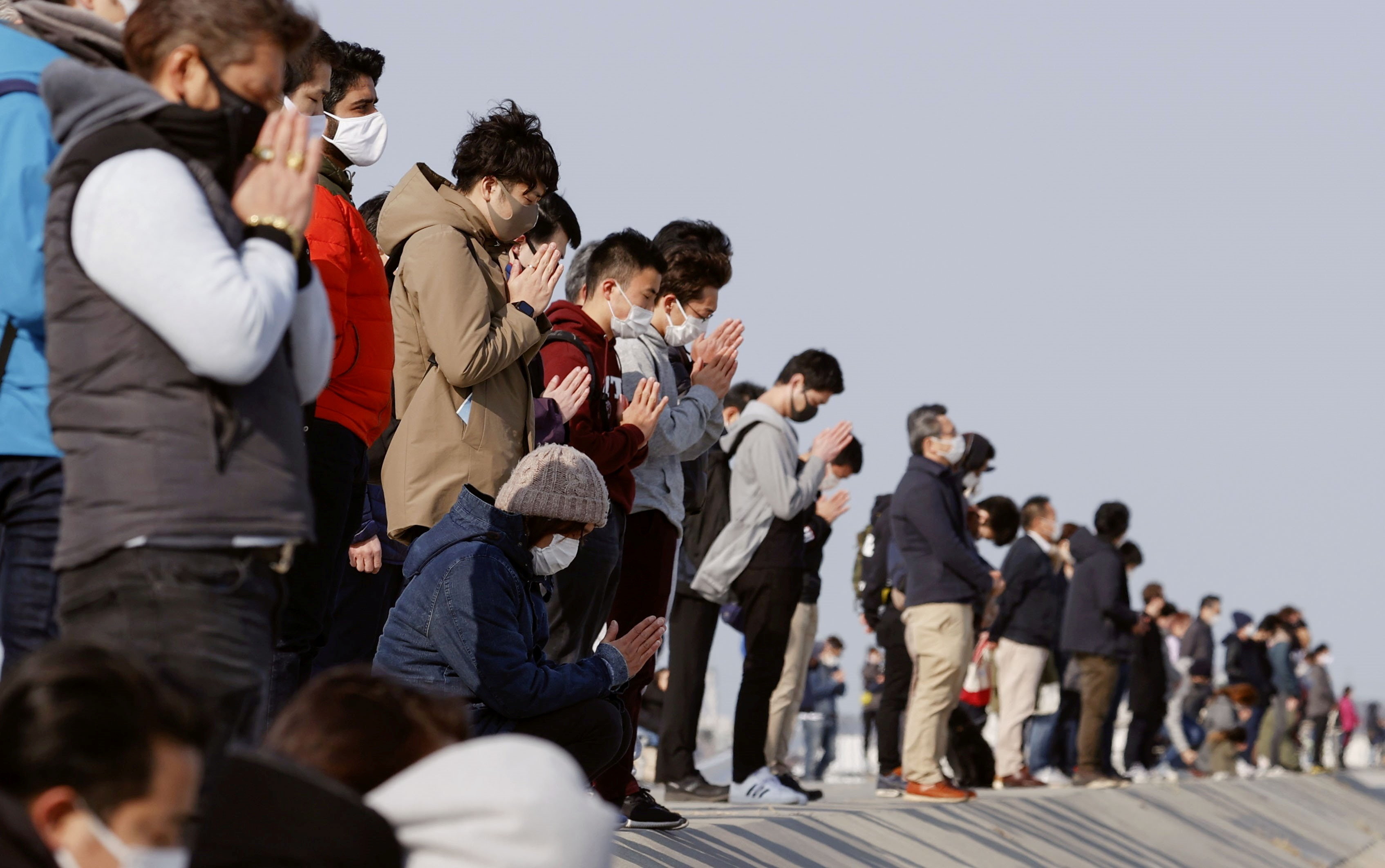 ▲▼日本民眾悼念311大地震。（圖／路透）