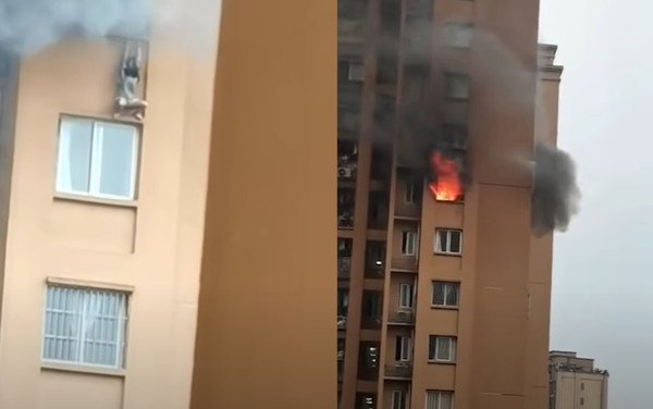高樓冒恐怖大火！23歲女住戶爬窗外躲避　鏡頭前失手墜樓。（圖／翻攝自YouTube／漩渦視頻）