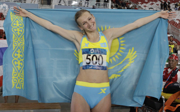 ▲哈薩克美女掌旗官雷帕科娃（Olga Rypakova）是三級跳遠好手。（圖／路透）