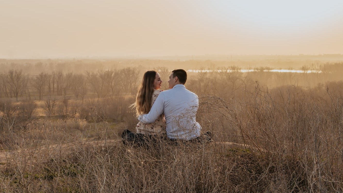 Two couples are sitting back view. Заперты вместе