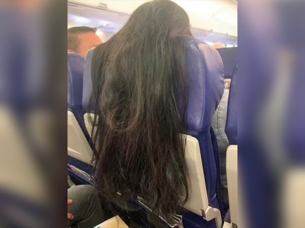 ▲▼飛機前座乘客把長髮披在椅背上。（圖／翻攝Twitter@Antman0528）