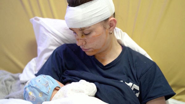 ▲▼烏克蘭基輔27歲媽媽奧爾加（Olga）在空襲中以肉身保護女兒，導致自己受重傷。（圖／路透）