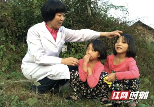 ▲羅紅和羅蘭是湖南第一對手術成功分離的雙胞胎女嬰。（圖／翻攝紅網）