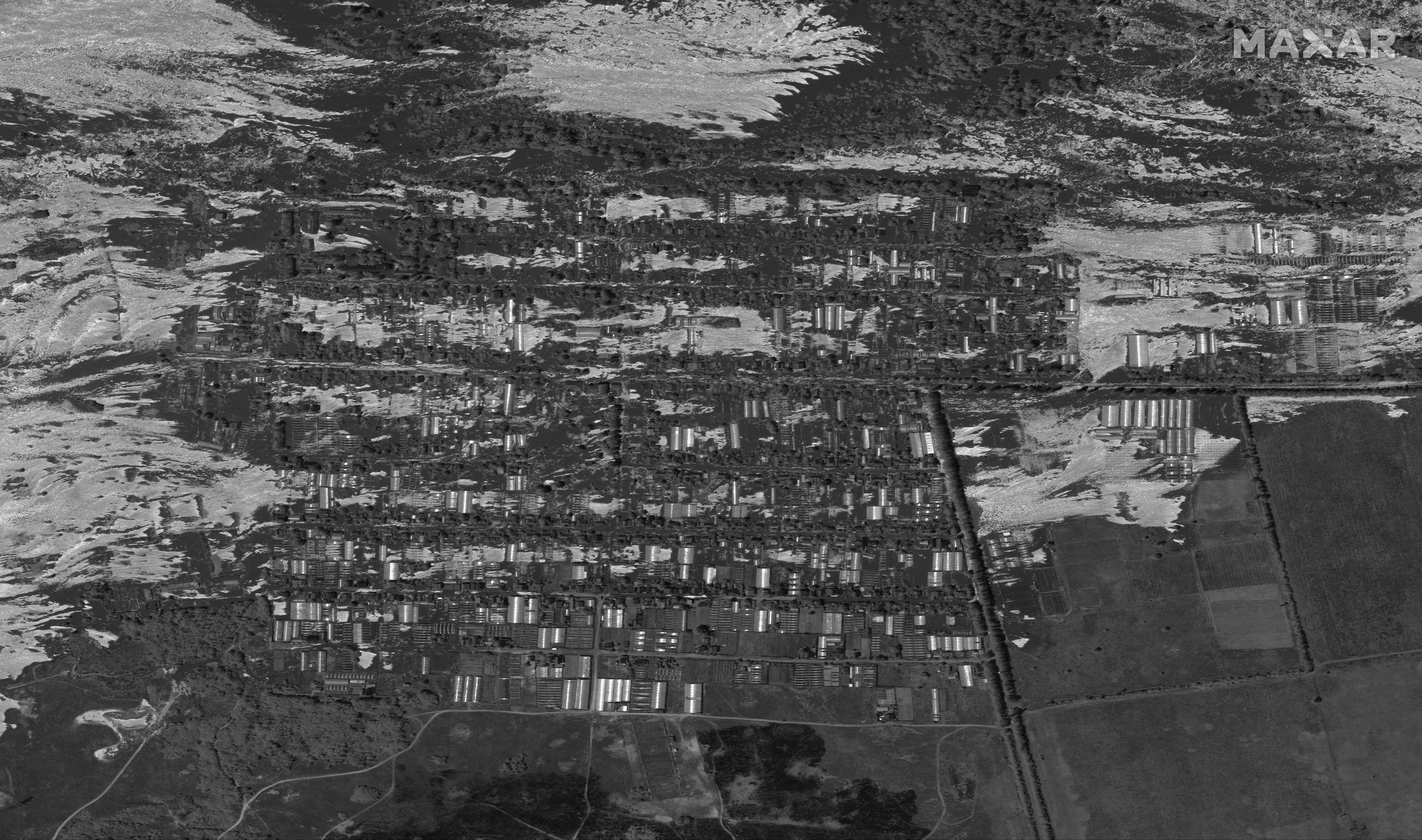 ▲▼新卡科夫卡水壩被炸毀，Maxar衛星照顯示赫爾松村莊Korsunka淹水災情。（圖／路透）