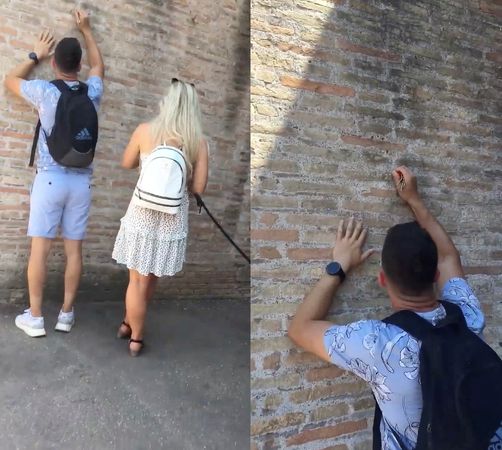 ▲▼31歲的英國健身教練迪米特羅夫（Ivan Dimitrov）拿鑰匙把自己和女友的名字刻在義大利羅馬競技場的古蹟磚牆上。（圖／路透）