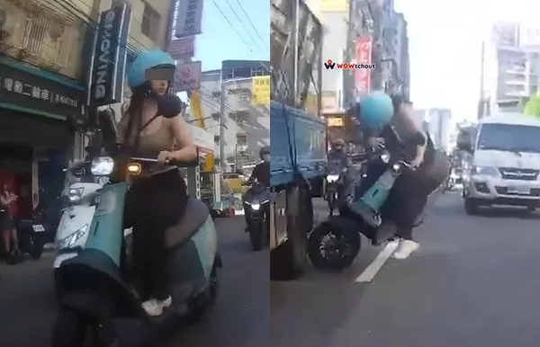 ▲▼永和背心正妹「往左看1秒」撞前車重摔　目擊者：10多人撐傘指揮交通。（圖／翻攝Wowtchout - 地圖型行車紀錄器分享平台）