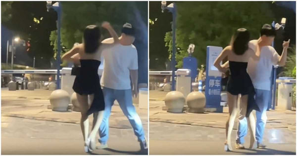 男子緊抓女友的手。