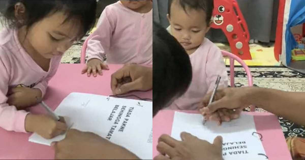 2位女兒依要求乖乖地簽名在協議書上。（圖翻攝TikTok＠abah_double_sumayyah）