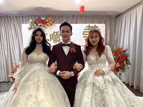 ▲▼馬來西亞有一名男子一次爽娶2妻，而2名女子同場舉行婚禮時也顯得十分高興。（圖／翻攝自Facebook）