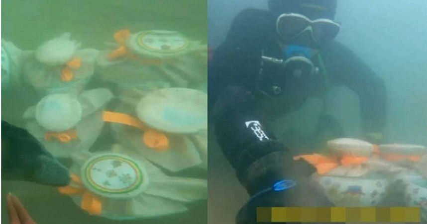 男子潛水時發現11個詭異密封罐。（圖／翻攝自微博）